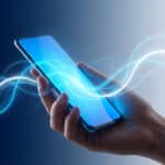 Generic hand holding a modern smartphone. Its screen emits a vibrant blue glow with flowing AI patterns against a blue-to-white gradient background.